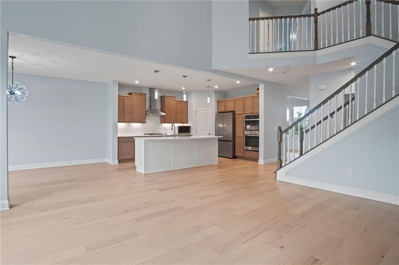 7945 Garnet Trace Ball Ground, GA 30107 - Photo 23 of 73 a view of a kitchen with a sink and an entryway