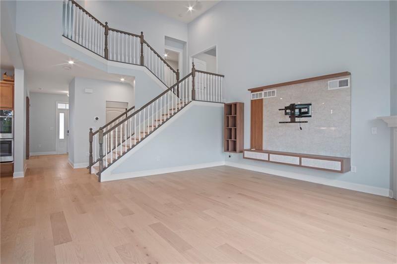 7945 Garnet Trace Ball Ground, GA 30107 - Photo 24 of 73 a view of a hallway with staircase
