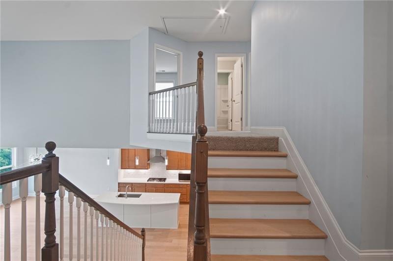 7945 Garnet Trace Ball Ground, GA 30107 - Photo 25 of 73 a view of entryway and hall with wooden floor