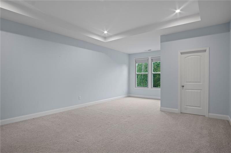 7945 Garnet Trace Ball Ground, GA 30107 - Photo 27 of 73 a view of a big room with closet and windows