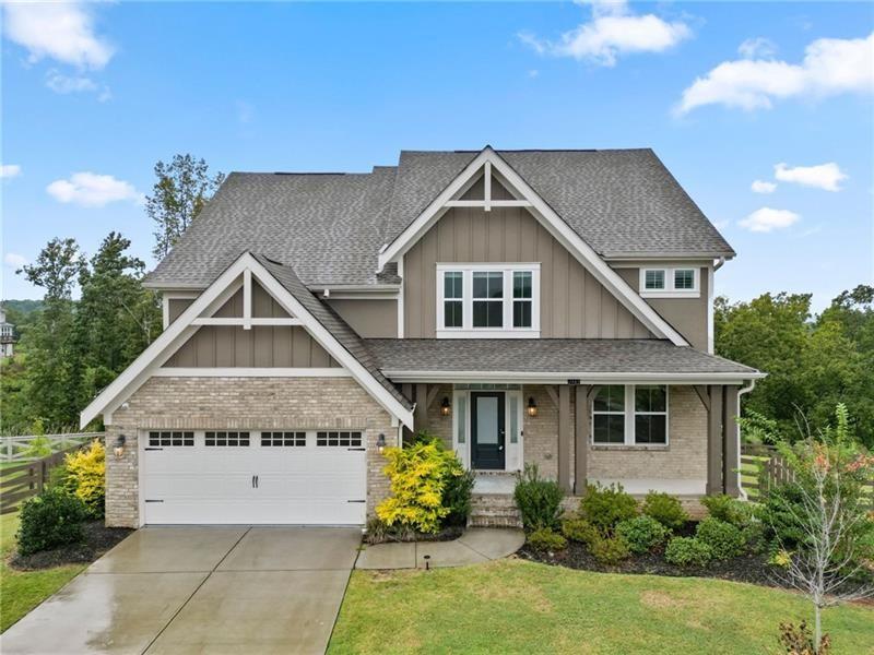 7945 Garnet Trace Ball Ground, GA 30107 - Photo 3 of 73 a aerial view of a house with table and chairs