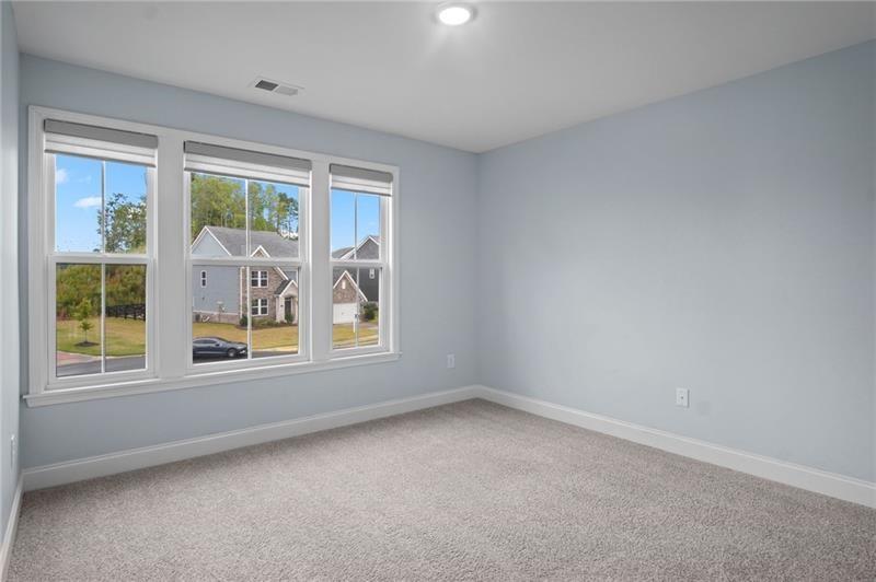7945 Garnet Trace Ball Ground, GA 30107 - Photo 33 of 73 an empty room with a window