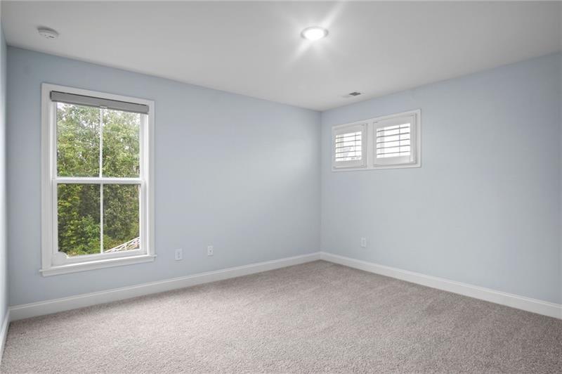 7945 Garnet Trace Ball Ground, GA 30107 - Photo 36 of 73 an empty room with a window