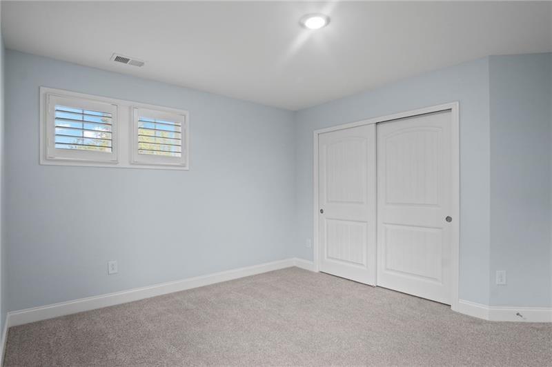 7945 Garnet Trace Ball Ground, GA 30107 - Photo 37 of 73 a view of an empty room with a window