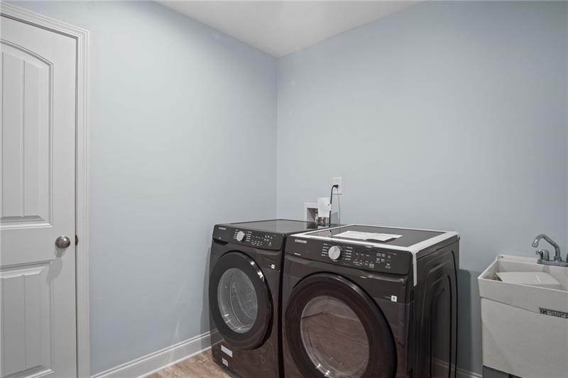 7945 Garnet Trace Ball Ground, GA 30107 - Photo 47 of 73 a view of storage and utility room with washer and dryer
