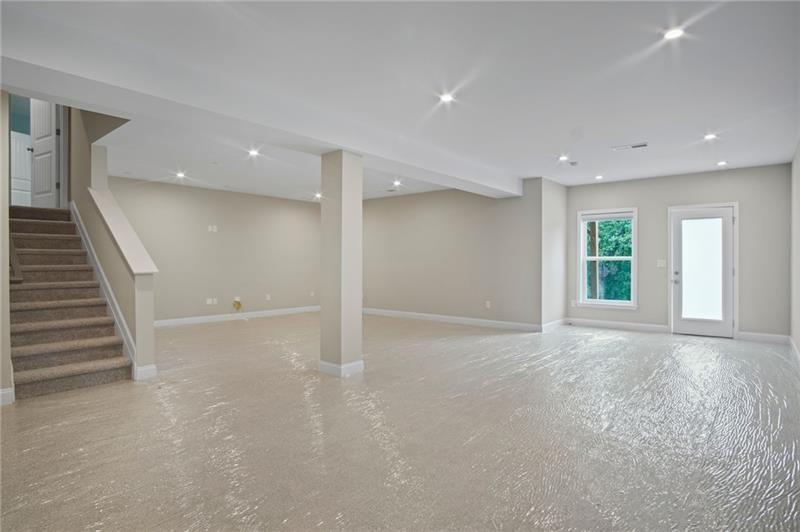 7945 Garnet Trace Ball Ground, GA 30107 - Photo 50 of 73 a view of an empty room with stairs