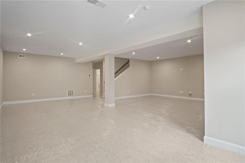 7945 Garnet Trace Ball Ground, GA 30107 - Photo 51 of 73 an empty room with a natural light