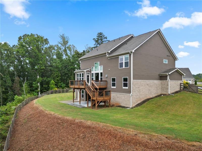 7945 Garnet Trace Ball Ground, GA 30107 - Photo 64 of 73 a view of a house with a yard and sitting area