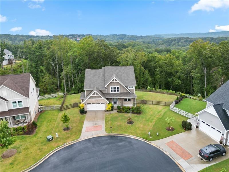 7945 Garnet Trace Ball Ground, GA 30107 - Photo 68 of 73 an aerial view of a house with a garden