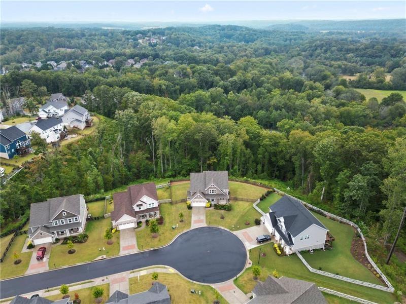 7945 Garnet Trace Ball Ground, GA 30107 - Photo 72 of 73 an aerial view of a house with pool lake view and mountain view