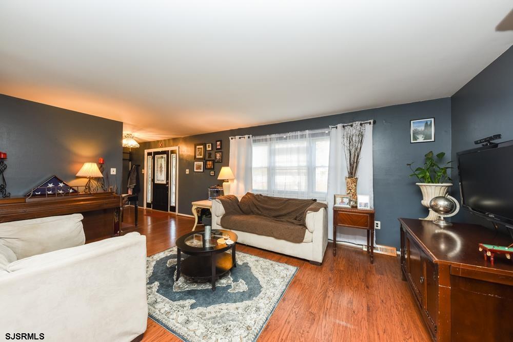 10 Williams Way Ocean View, NJ 08230 - Photo 12 of 28 a living room with furniture and a flat screen tv