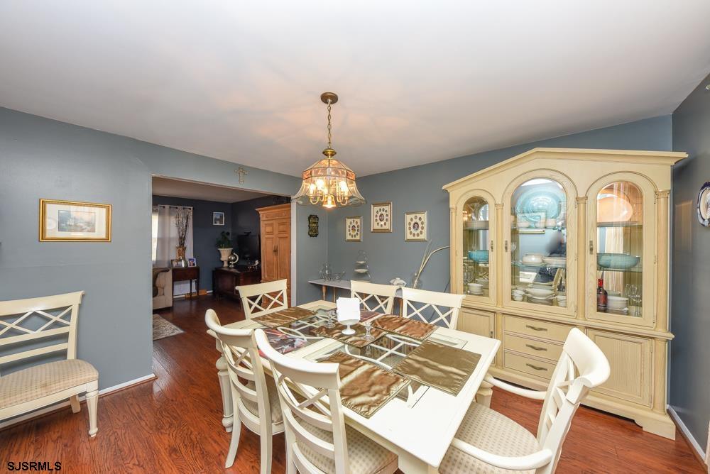 10 Williams Way Ocean View, NJ 08230 - Photo 14 of 28 a view of a dining room with furniture wooden floor and chandelier