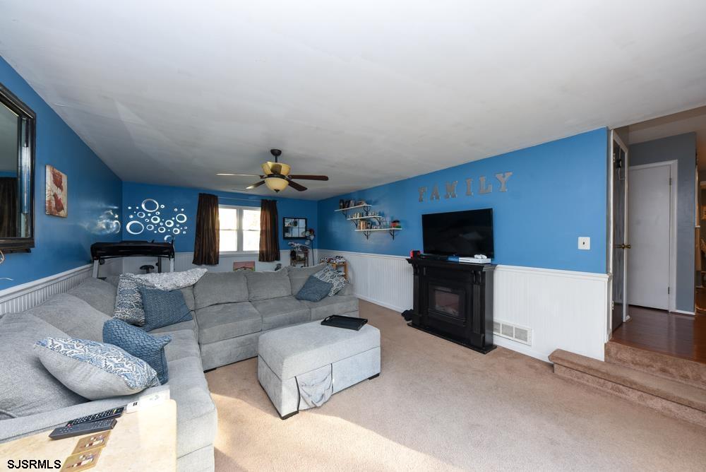 10 Williams Way Ocean View, NJ 08230 - Photo 19 of 28 a living room with furniture and a flat screen tv