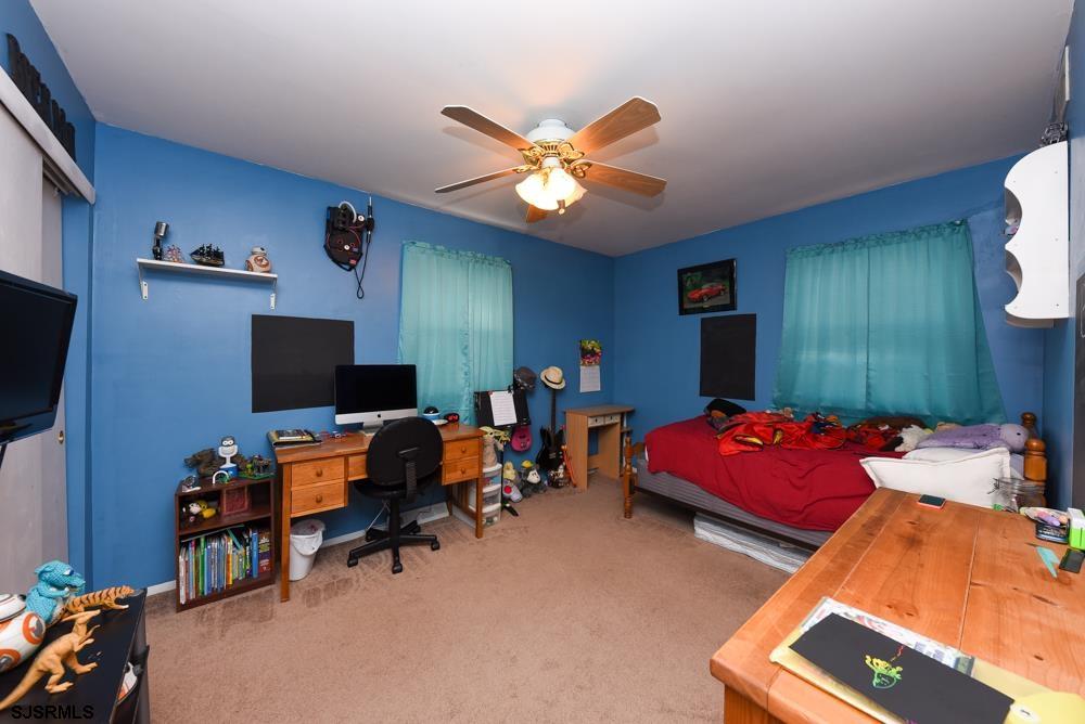 10 Williams Way Ocean View, NJ 08230 - Photo 22 of 28 a bedroom with furniture and a flat screen tv