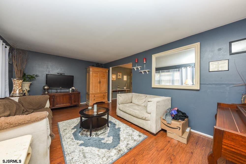 10 Williams Way Ocean View, NJ 08230 - Photo 10 of 28 a living room with furniture and a flat screen tv