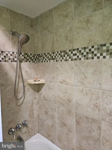 a view of a backyard with wooden fence