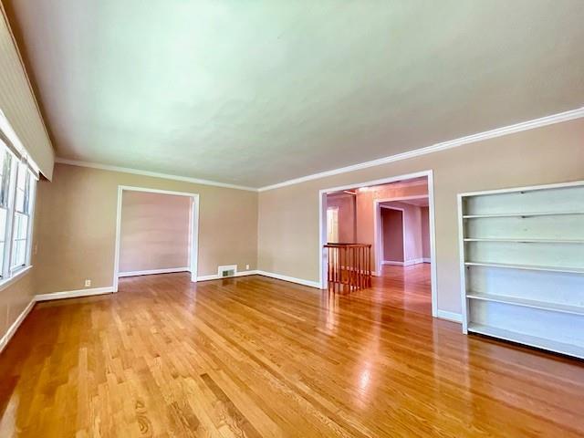 2396 Lavista Road Northeast Atlanta, GA 30329 - Photo 3 of 28 a view of empty room with wooden floor and window