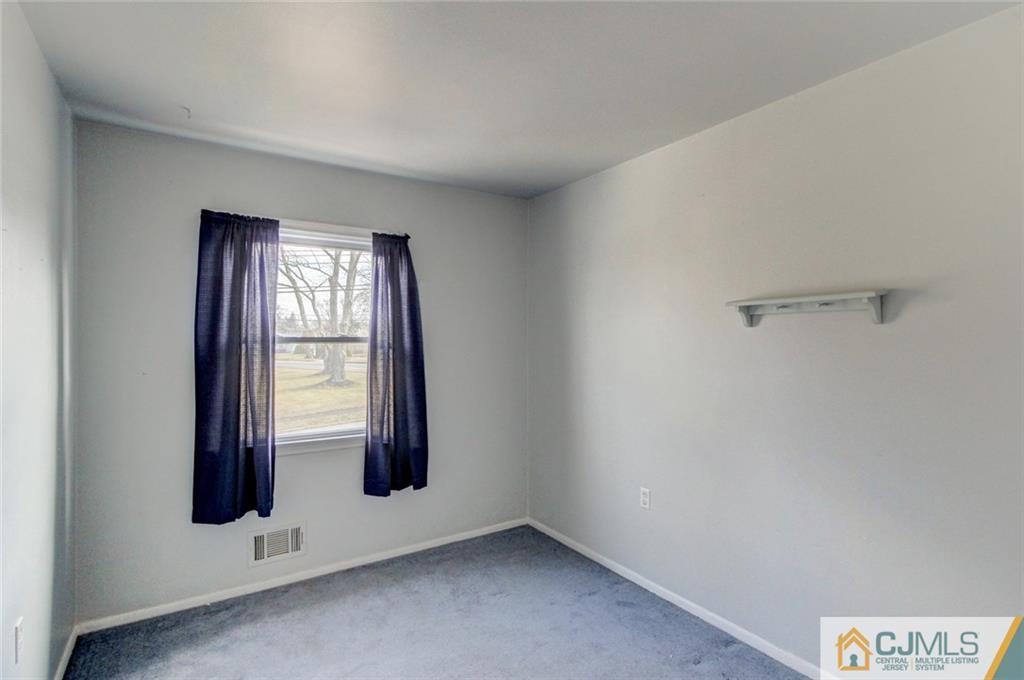 9 A Birch Drive Jackson, NJ 08527 - Photo 13 of 27 an empty room with windows