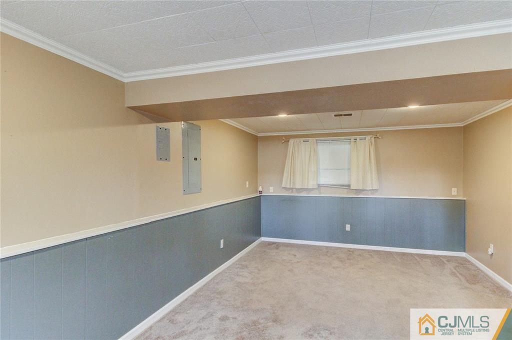 9 A Birch Drive Jackson, NJ 08527 - Photo 16 of 27 a view of an empty room and window