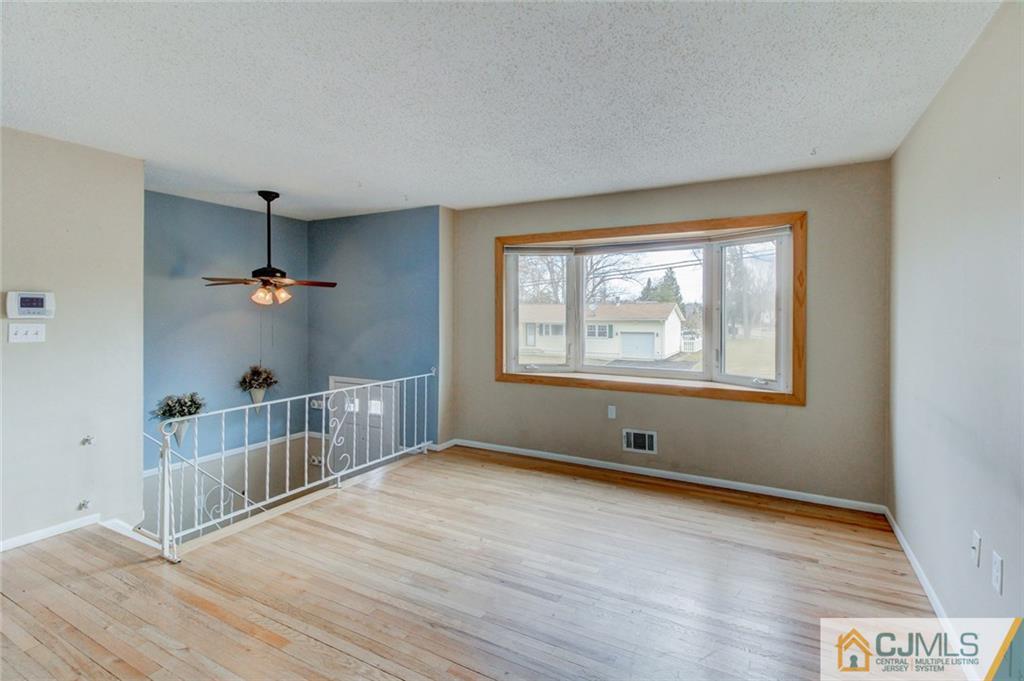 9 A Birch Drive Jackson, NJ 08527 - Photo 3 of 27 a view of an empty room with a window