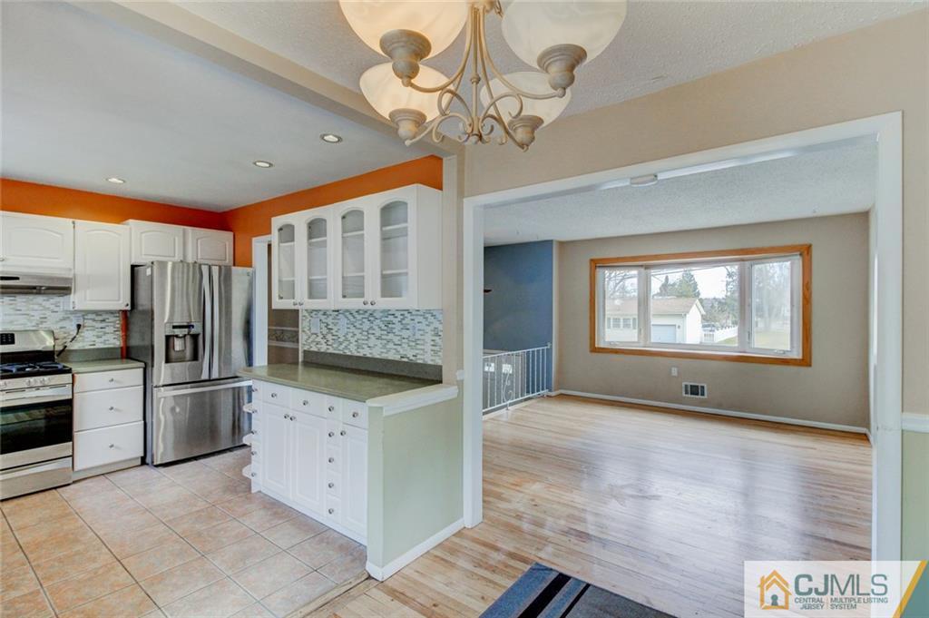 9 A Birch Drive Jackson, NJ 08527 - Photo 8 of 27 a kitchen with stainless steel appliances granite countertop a refrigerator a oven a sink and dishwasher