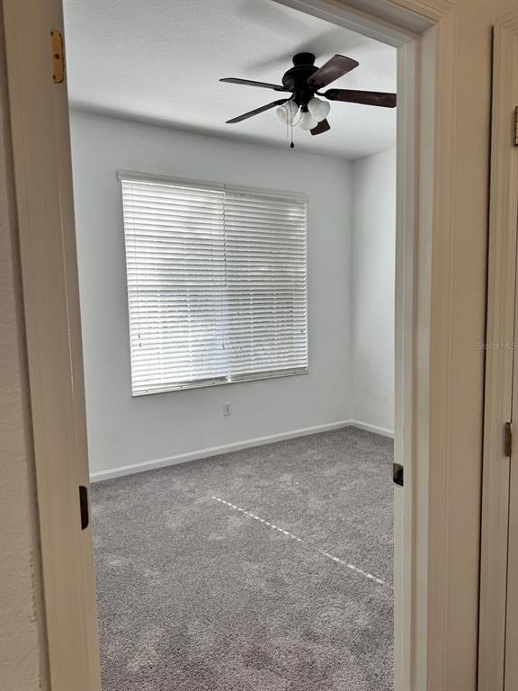 3001 Greystone Loop, Unit 201 Kissimmee, FL 34741 - Photo 11 of 26 a view of an empty room with a window