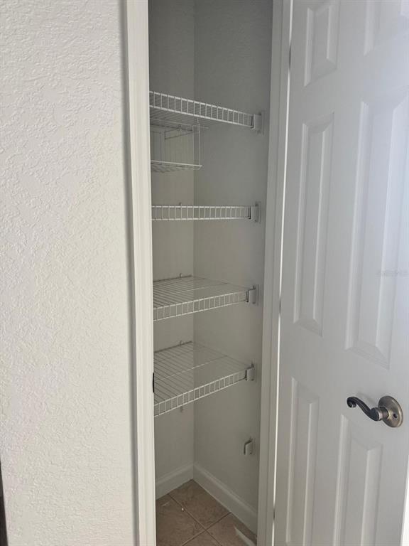 3001 Greystone Loop, Unit 201 Kissimmee, FL 34741 - Photo 17 of 26 a bathroom with a glass shower door