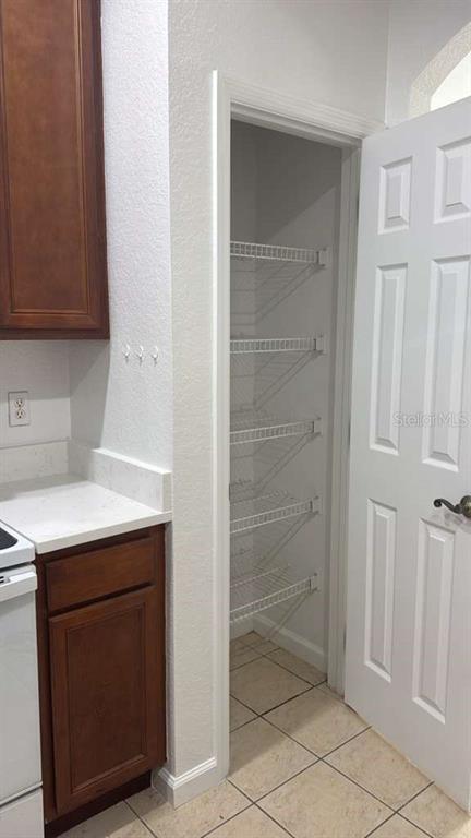 3001 Greystone Loop, Unit 201 Kissimmee, FL 34741 - Photo 18 of 26 a bathroom with a sink and a shower