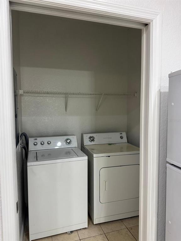 3001 Greystone Loop, Unit 201 Kissimmee, FL 34741 - Photo 19 of 26 a utility room with dryer and washer