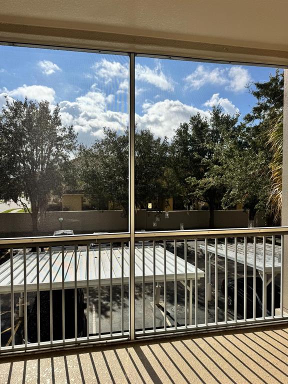 3001 Greystone Loop, Unit 201 Kissimmee, FL 34741 - Photo 20 of 26 a view of a balcony with a yard
