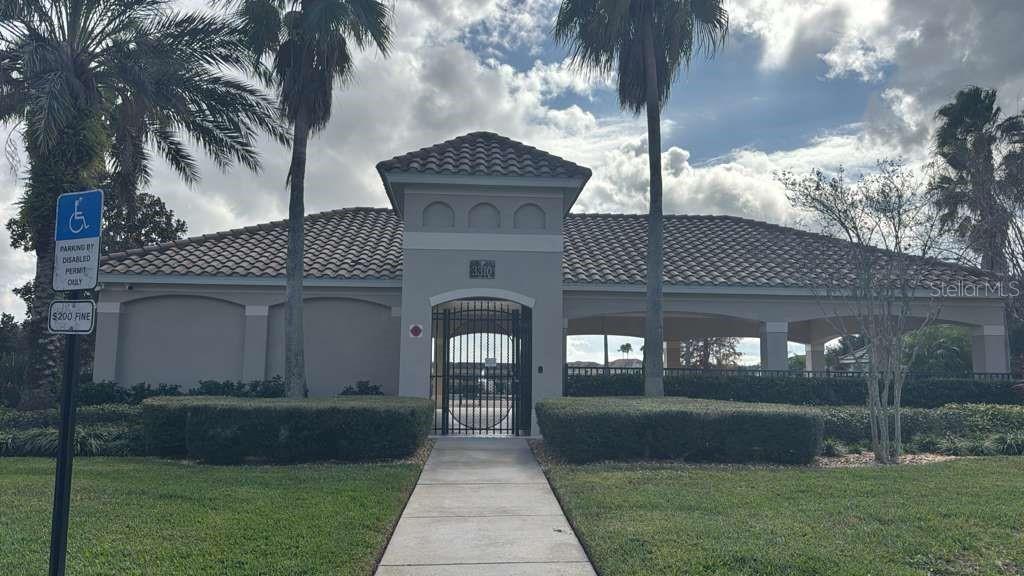 3001 Greystone Loop, Unit 201 Kissimmee, FL 34741 - Photo 24 of 26 a front view of a house with garden