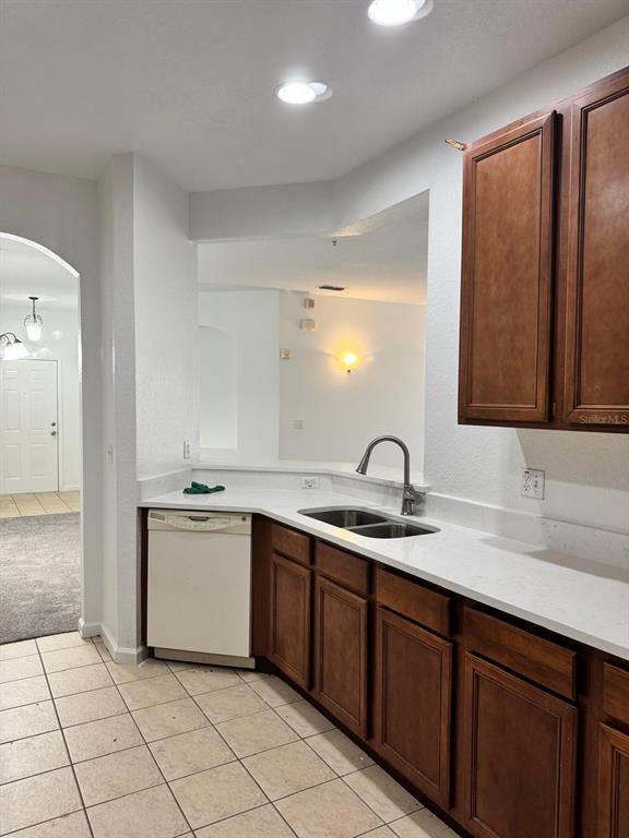 3001 Greystone Loop, Unit 201 Kissimmee, FL 34741 - Photo 5 of 26 a kitchen with a sink and cabinets