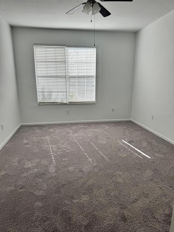 3001 Greystone Loop, Unit 201 Kissimmee, FL 34741 - Photo 8 of 26 an empty room with windows