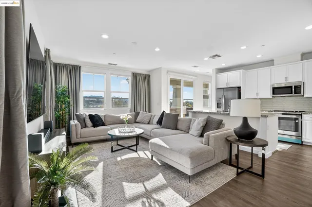 a kitchen with sink stove and wooden floor