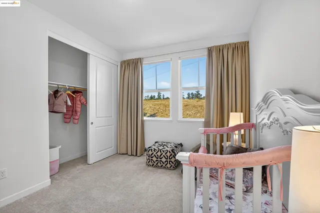 a bedroom with furniture and a window