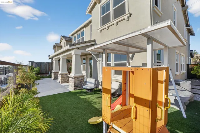a view of a patio with couches chairs and potted plants
