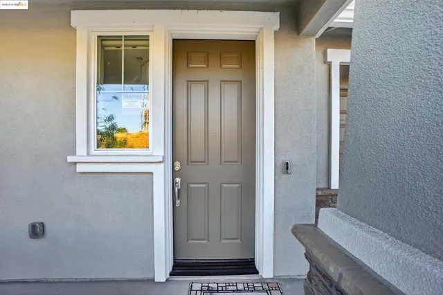 a view of a hallway view with wooden floor and staircase