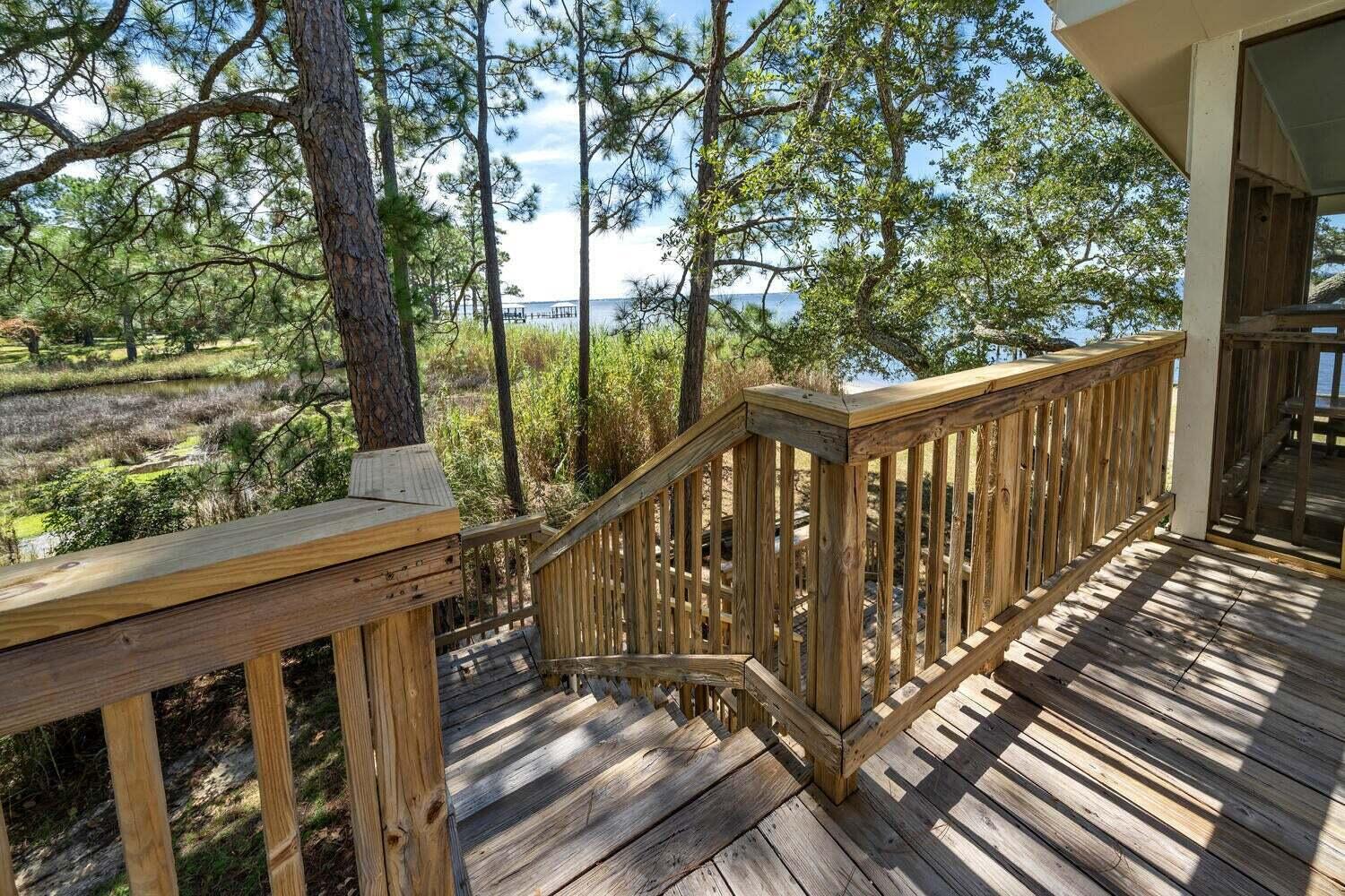 2030 Bay Grove Road Freeport, FL 32439 - Photo 16 of 22 a view of balcony with wooden floor and fence