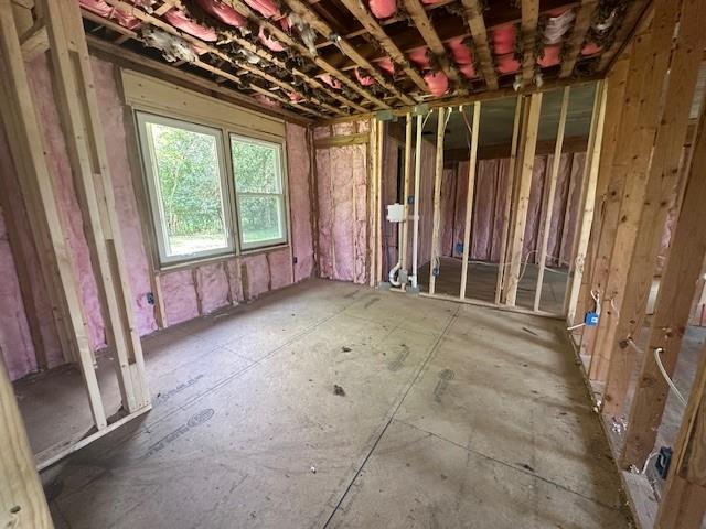 756 Old Summerville Road Northwest Rome, GA 30165 - Photo 7 of 13 a view of an empty room with a fireplace and a window