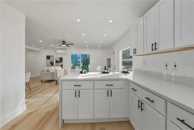 a kitchen with sink and cabinets