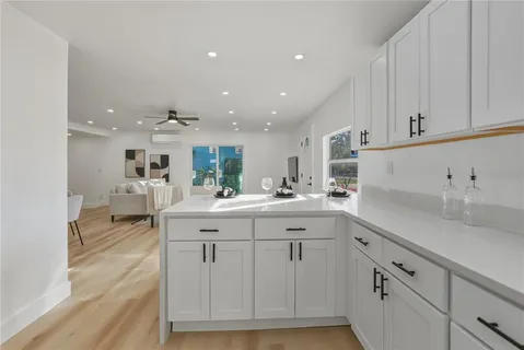 a kitchen with sink and cabinets