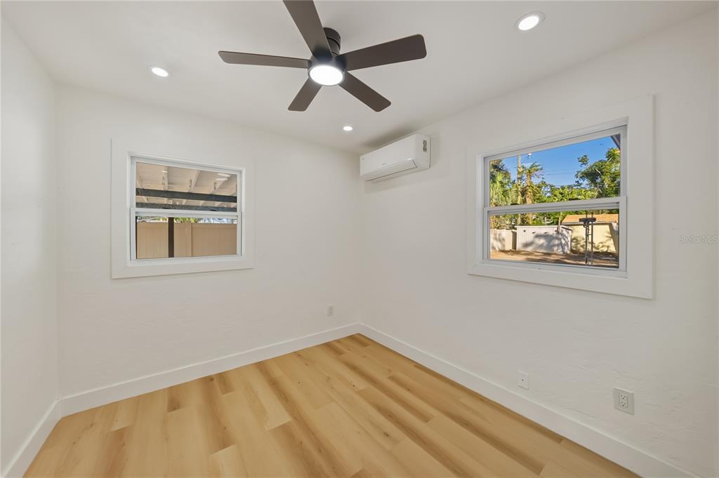 542 64th Street South St. Petersburg, FL 33707 - Photo 21 of 53 a view of empty room with wooden floor and ceiling fan