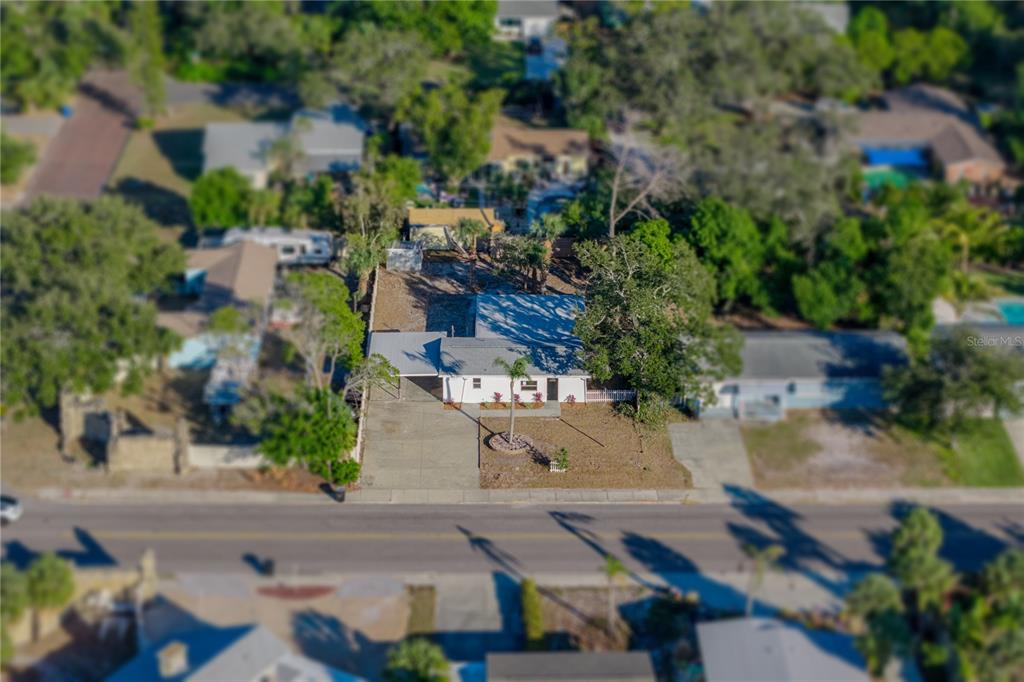 542 64th Street South St. Petersburg, FL 33707 - Photo 39 of 53 an aerial view of residential houses with outdoor space