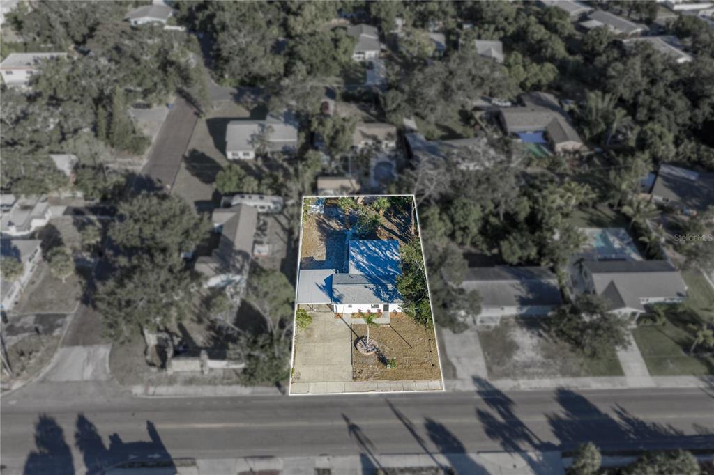 542 64th Street South St. Petersburg, FL 33707 - Photo 39 of 49 an aerial view of a house with a yard