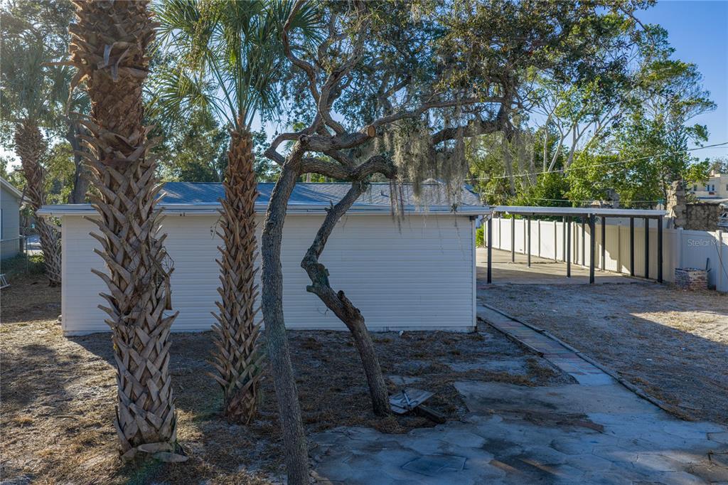 542 64th Street South St. Petersburg, FL 33707 - Photo 44 of 49 a view of backyard with deck and trees