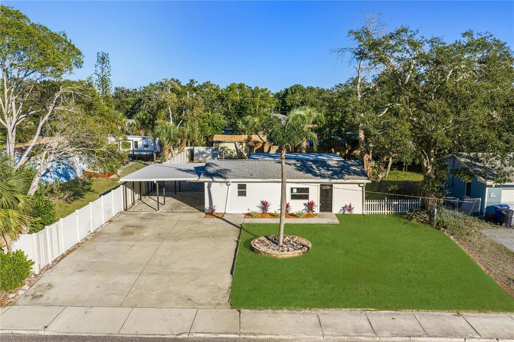 542 64th Street South St. Petersburg, FL 33707 - Photo 52 of 53 a view of a house with a yard porch and sitting area