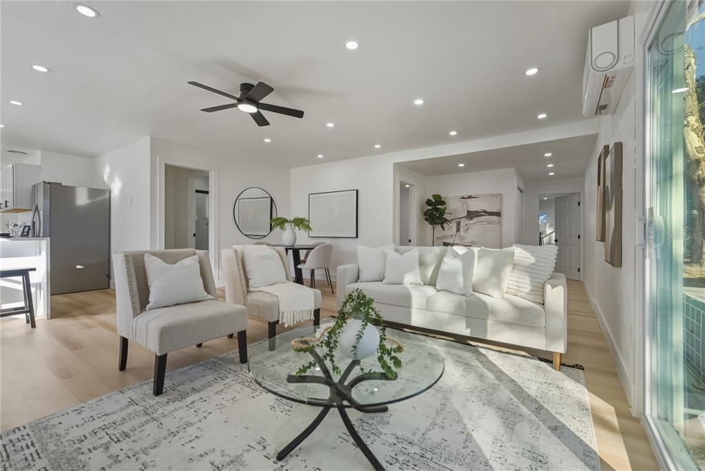 542 64th Street South St. Petersburg, FL 33707 - Photo 6 of 49 a living room with furniture and kitchen view