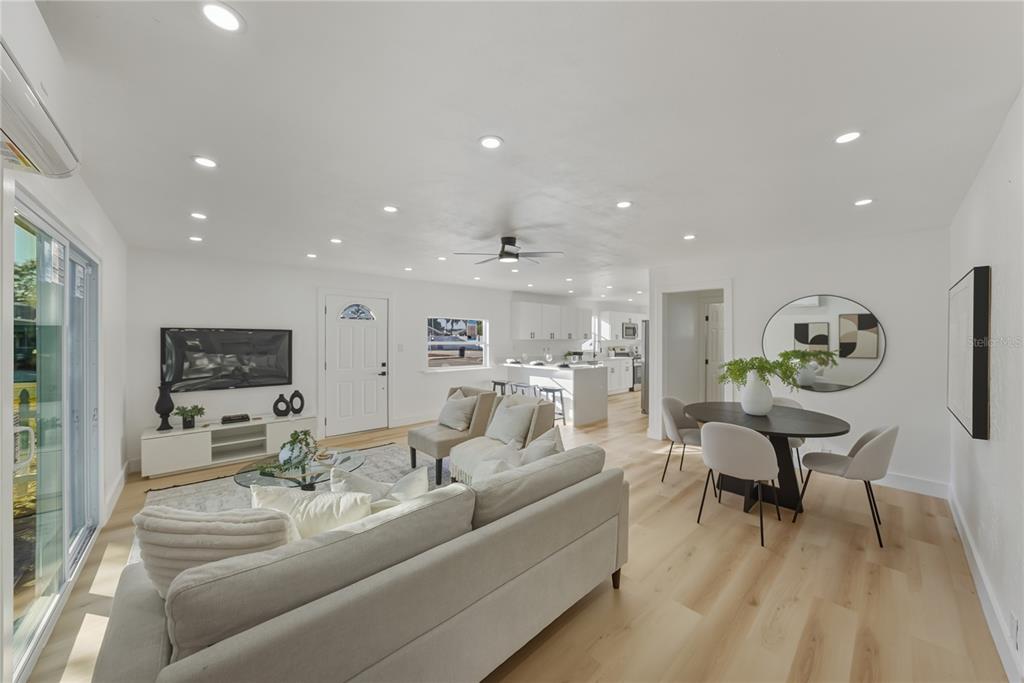 542 64th Street South St. Petersburg, FL 33707 - Photo 8 of 49 a living room with furniture and a flat screen tv