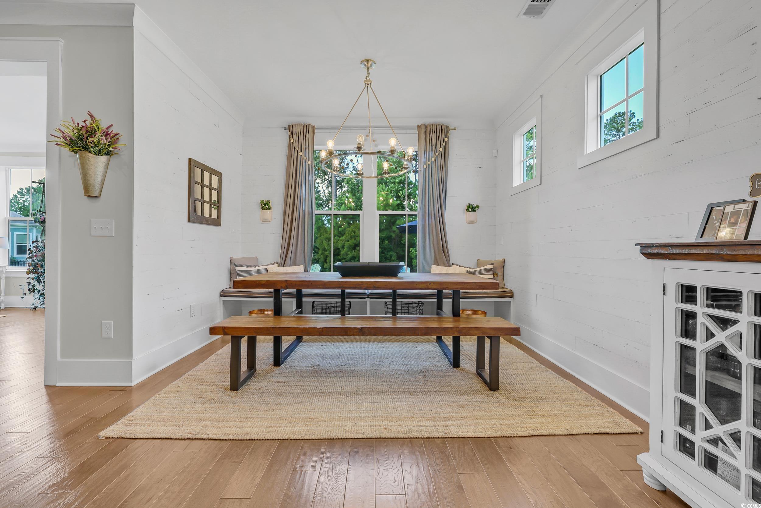 3005 Purity Place Loop Murrells Inlet, SC 29576 - Photo 13 of 36 Dining area featuring a chandelier and hardwood /
