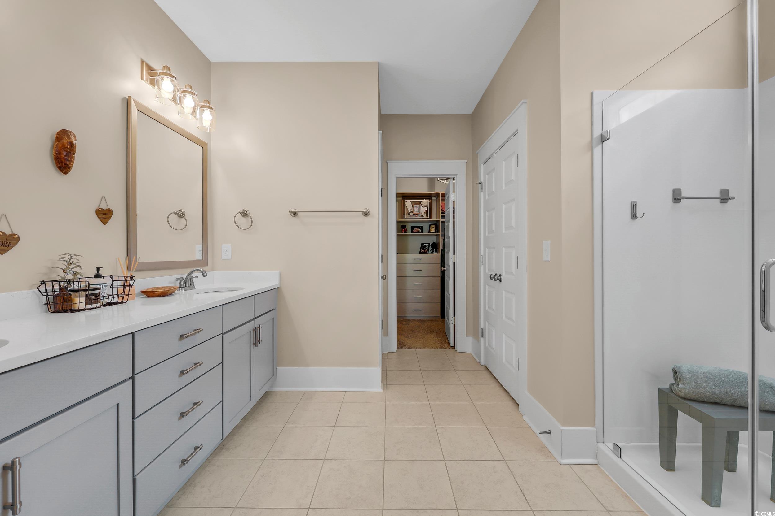 3005 Purity Place Loop Murrells Inlet, SC 29576 - Photo 19 of 36 Full bathroom featuring double vanity, a stall sho